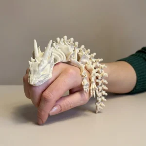 Articulated Skeleton Dragon wrapped around a hand, white 3D printed PLA+ scale photo