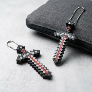 Pixelated Sword and Cross keychain lifestyle product image, 3D printed PLA+